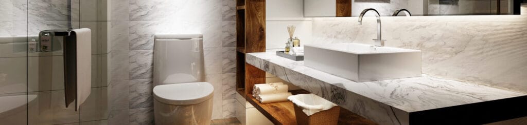 Luxe badkamer met grote marmerlook wandtegels en een bijpassend marmeren wastafelblad. De tegels geven de ruimte een elegante, moderne uitstraling, ideaal voor een stijlvolle en onderhoudsvriendelijke badkamer.